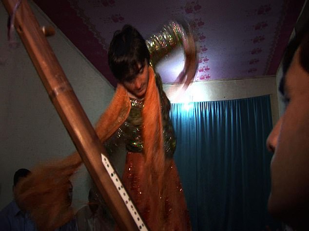 The barbaric tradition, whose name translates directly to 'boy play',sees young boys adorned in makeup, dressed in brightly coloured women's clothing and sent before groups of powerful men to dance and entertain