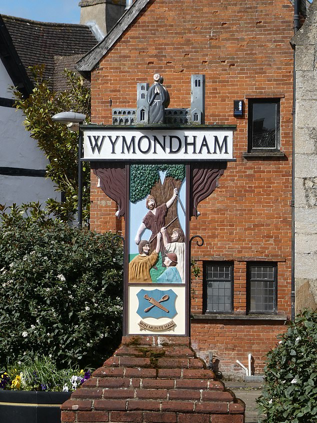 Wymondham's town sign depicts Robert Kett, leader of the 1549 Rebellion, and a wood-turner on the other side. The Arms of the town, a wooden spoon and a spigot, appear on both sides, as Wymondham was famous as a centre of the wood-turning industry