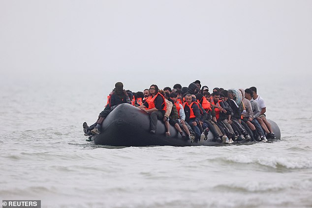 A group of migrants on an inflatable dinghy leave the coast of northern France in an attempt to cross the English Channel to reach Britain, from the beach of Petit-Fort-Philippe in Gravelines, near Calais, France, July 2