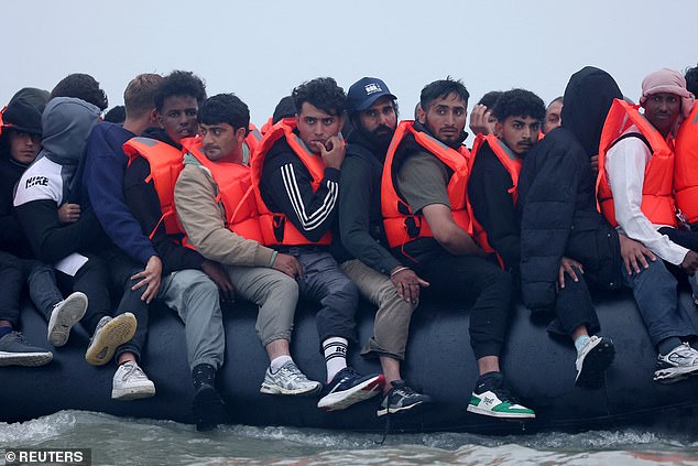 A group of migrants on an inflatable dinghy leave the coast of northern France in an attempt to cross the English Channel to reach Britain, from the beach of Petit-Fort-Philippe in Gravelines, near Calais, France, July 2, 2025