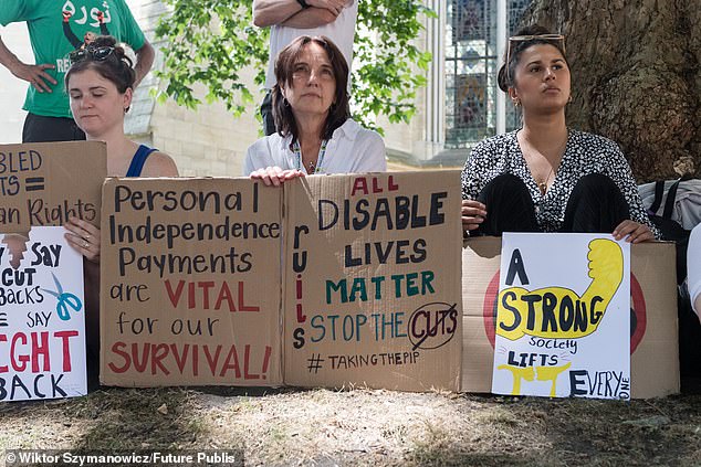 Disabled people and their supporters gather outside the Houses of Parliament for a protest against cuts to welfare benefits as MPs debate and vote today on the government's Welfare Reform Bill at its second reading in London, United Kingdom on July 01, 2025