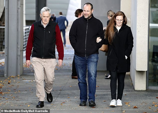 David Wilkinson (centre) was frontg and centre in court every day