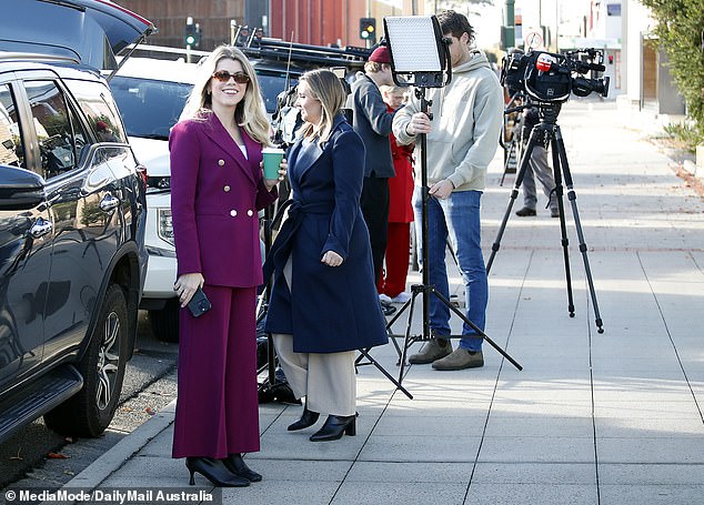 Channel 9's Amber Johnston (left) and Penny Liersch (right) outside the Latrobe Valley Law Courts. They started early and worked late and brightened some very gloomy days