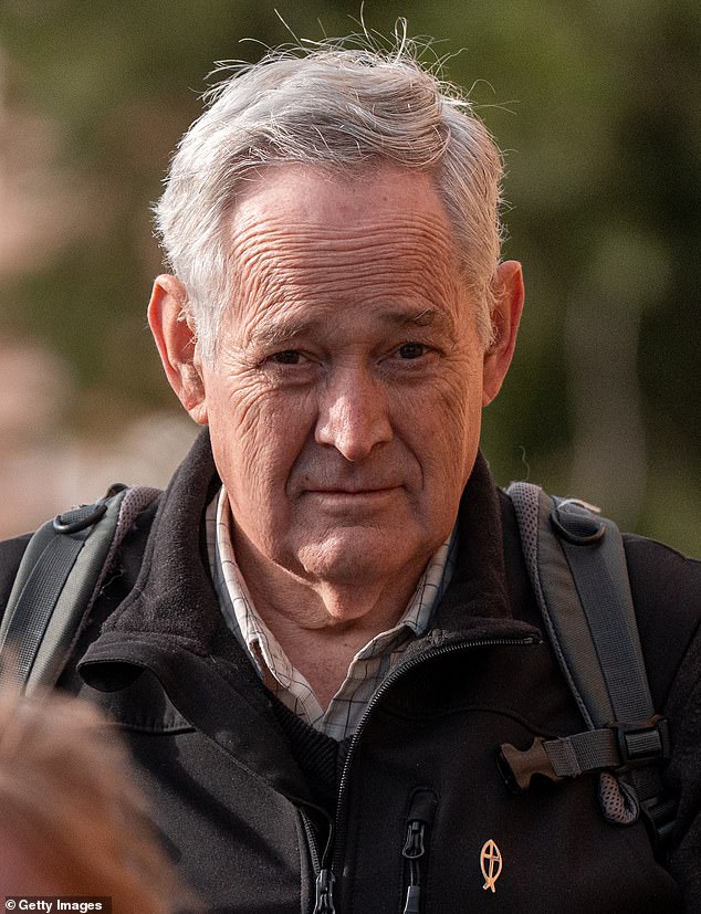 Ian Wilkinson (pictured at court) wears an early Christian fish symbol as he attends the trial at which Erin described some of his testimony as incorrect
