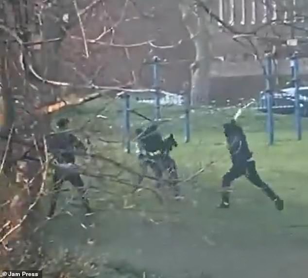 A trio dressed in tracksuits and baclavas as they surround a man victim at Pennyfields Park