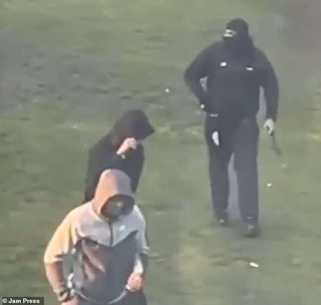 The three attackers make their escape following the assault which took place in broad daylight