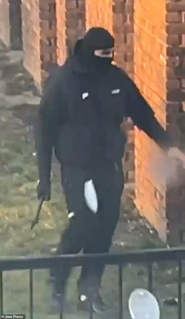 One of the men was seen walking away carrying what appeared to be an axe in his right hand
