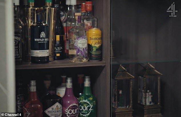 Jack Daniel's whiskey, Whitley Neil blackcurrant gin and Sourz shots are found in a cabinet