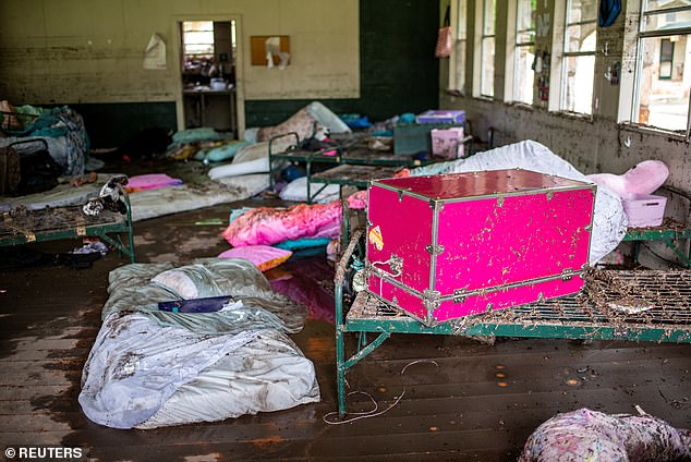 Callie said the flood came on fast, and at first, she didn't think it was anything more than a storm (Pictured: items scattered after the flooding ruined camp cabins)