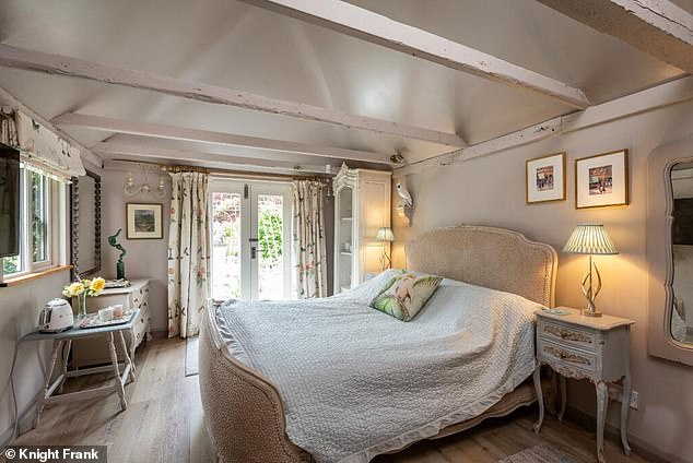 Quaint: One of the four bedrooms at Rose Cottage, which also has four bathrooms