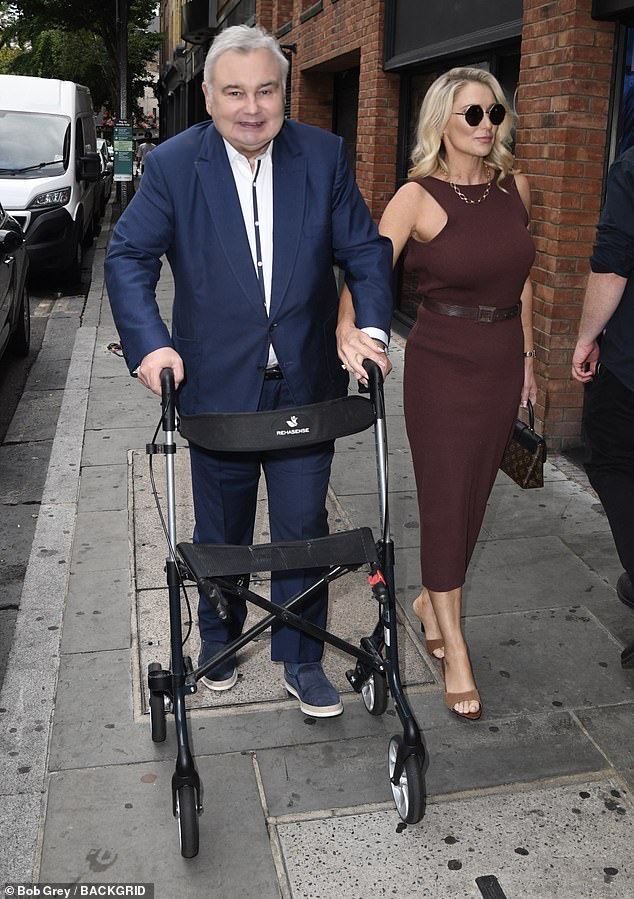 Eamonn was supported by his girlfriend Katie Alexander as he enlisted the help of a walking frame to make his way into the event