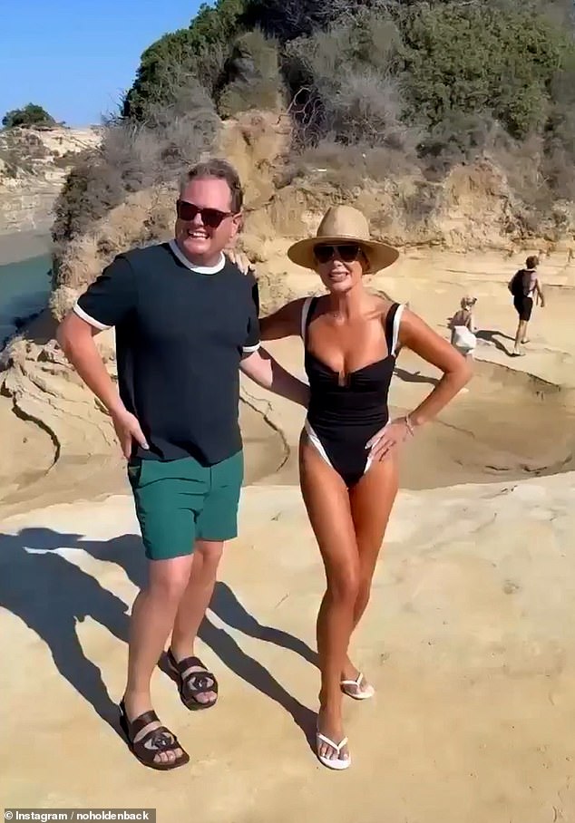Amanda showcased her sensational figure in a plunging swimsuit while soaking in the Greek sunshine on Sunday alongside Alan Carr