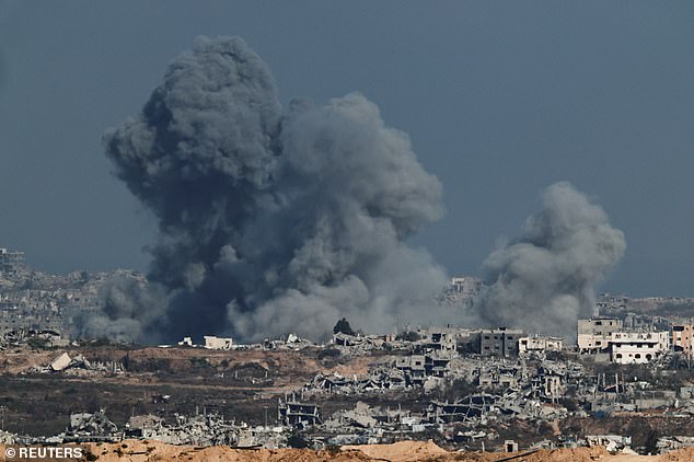 Smoke rises in Gaza after an explosion, as seen from the Israeli side of the Israel-Gaza border, July 7, 2025