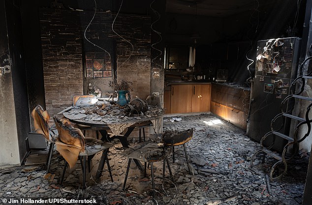 The interior of a kitchen and dinning room area in a civilian house in the Jewish community of Kibbutz Be'eri along the border with the Gaza Strip during a press tour on October 20, 2023