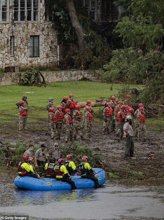 HUNT, TEXAS - JULY 6: Search and recovery workers dig through debris looking for any survivors or remains of people swept up in the flash flooding at Camp Mystic on July 6, 2025 in Hunt, Texas. Heavy rainfall caused flooding along the Guadalupe River in central Texas with multiple fatalities reported. (Photo by Jim Vondruska/Getty Images)