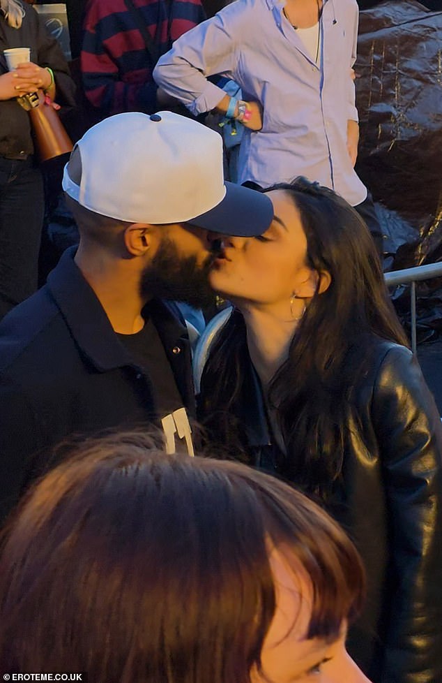 Zegler's new man was seen hugging her from behind as they watched the show before they shared a kiss