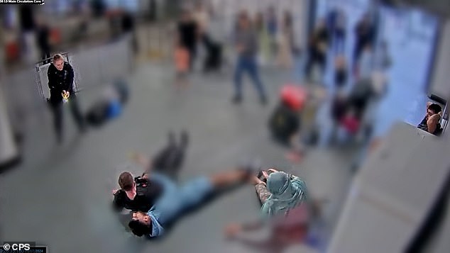 Pc Zachary Marsden ¿ who was armed ¿ had been trying to control Amaaz (pictured on the floor in the blue