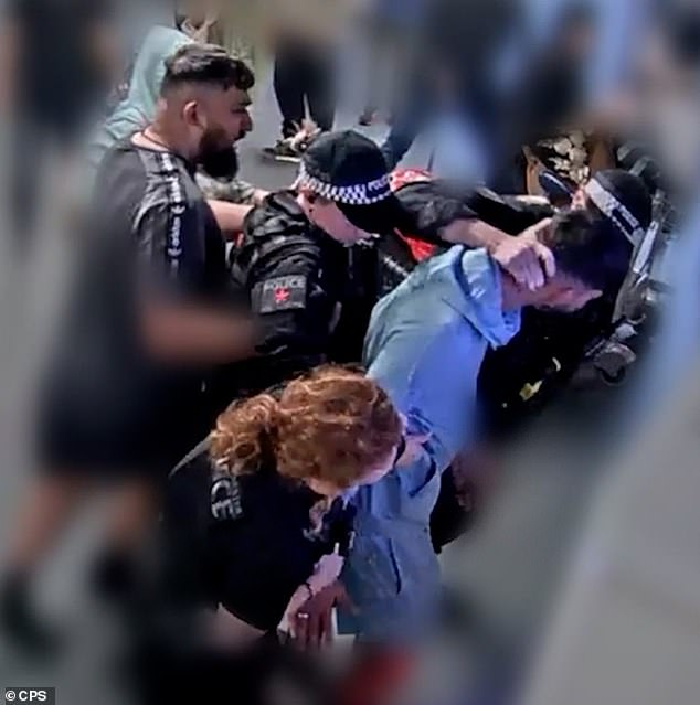 Amaaz (in the blue) was seen to throw ten punches at the officers during the violence while his brother - Muhammad Amaad (far left), 26, who is also on trial ¿ threw six