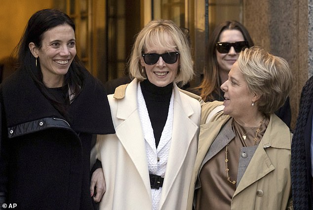 Carroll (center) was awarded an additional $83 million in January 2024.