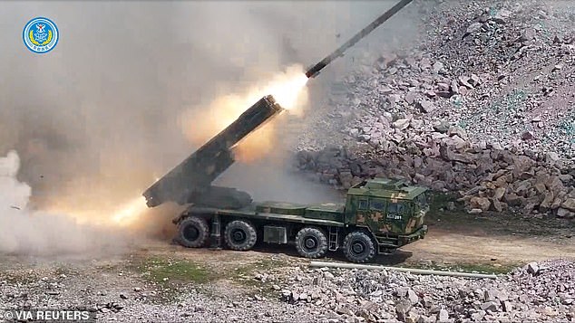 Military equipment takes part in long-range live-fire drills in waters of the East China Sea, in this screenshot from a handout video released by the Eastern Theatre Command of China's People's Liberation Army (PLA) on April 2, 2025