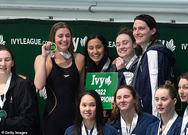 Thomas poses with Penn teammates Hannah Kannan, Camryn Carter, and Kaczorowski after winning the 400 yard free relay at the 2022 Ivy League championships