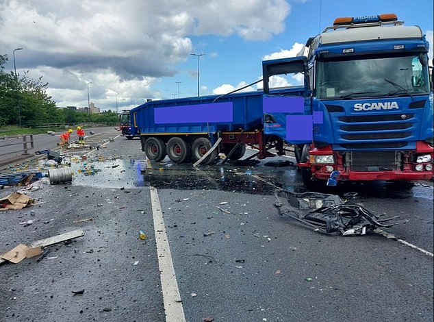 Another of the large lorries shed its load of large beer barrels across multiple lanes of the motorway