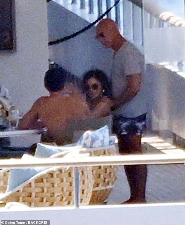 Orlando is seen with newlyweds Sanchez and Bezos