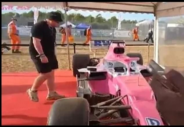 'Chazza' was seen approaching the car on display and there was a snapping sound
