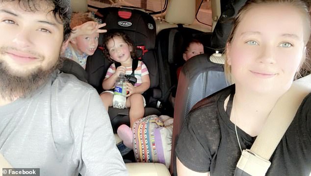 Julian Ryan, 27, is being hailed a hero after he used his final moments to save his family from the fast-moving waters. He died after punching through a window of their trailer home and severing his artery