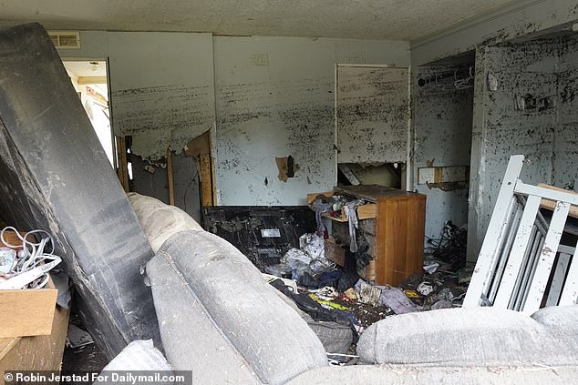 Inside Ryan's trailer, flood marks almost reached the ceiling while the family's furniture was tossed around like toys by the water