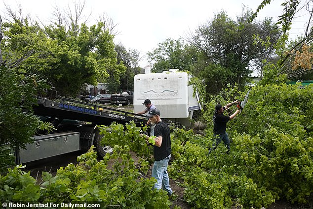 Crushed cars lie on the Guadalupe's banks while upturned boats were scattered around – ripped from their moorings by the force of the current.