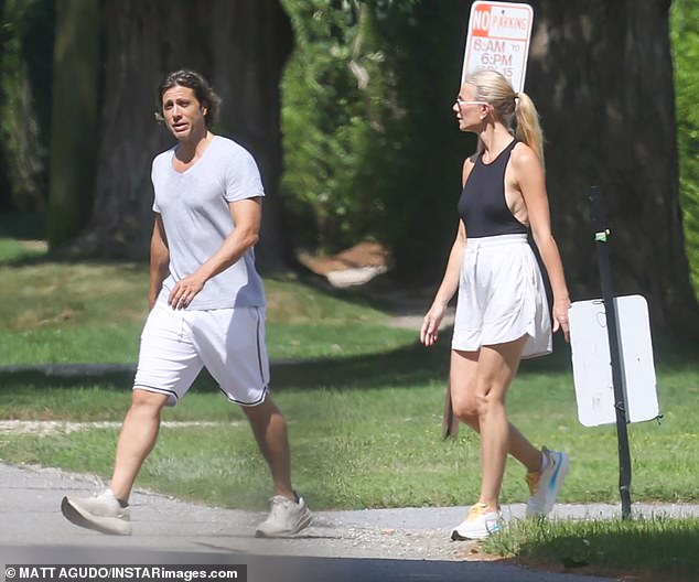 They each had serious frowns on their faces as they walked through the chic town over the weekend