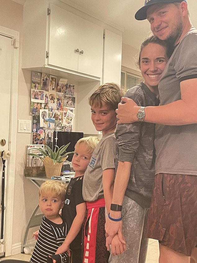 Marisa is pictured above with her family at home. Also shown clearly is her Whoop, which kept saying she was healthy until just after the diagnosis