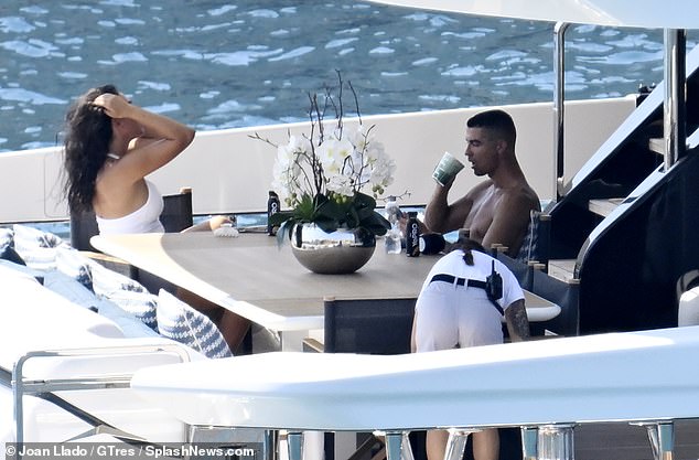 The former Manchester United forward and Portugal captain takes a swig of his drink