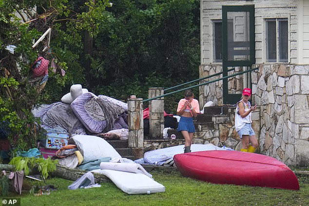 Survivors of the devastating flood described the experience as a 'pitch black wall of death.' (Pictured: the destruction at Camp Mystic after the tragedy)