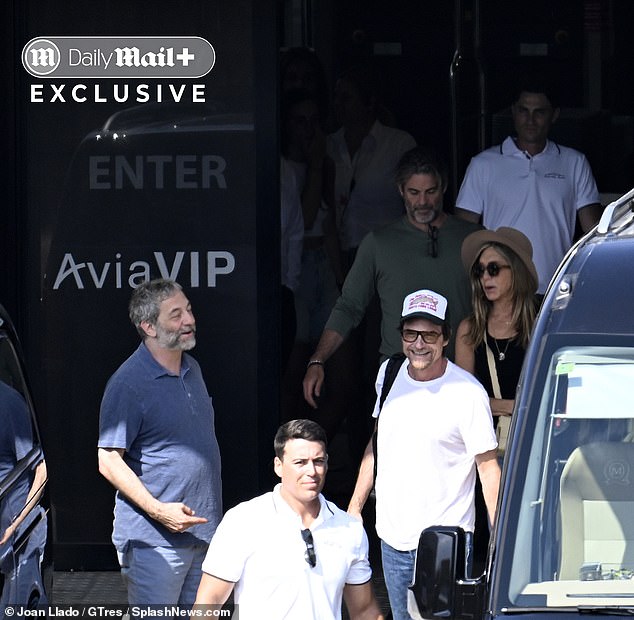 The group - including Aniston's BFF Jason Bateman (in cap) - looked in great spirits as they headed out