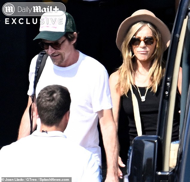 Aniston was stepping out with pal Bateman for the day