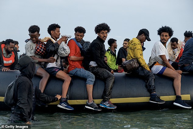 A small boat heads off in to the English Channel after picking up migrants at sunrise on July 02, 2025 in Gravelines, France