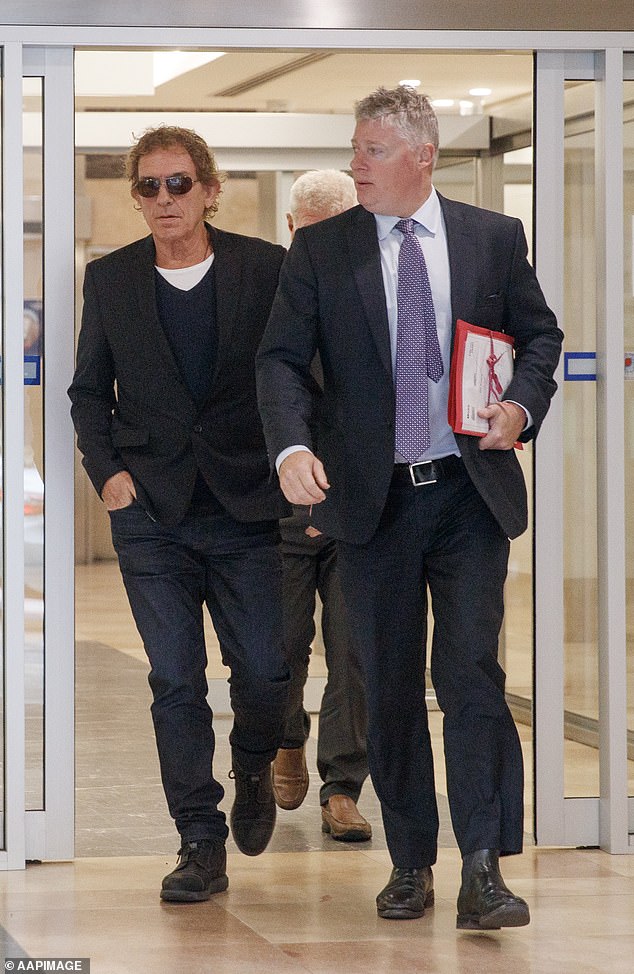 Moss fronted a magistrate in John Madison Tower because the adjacent Downing Centre Local Court is closed due to flooding caused by a burst water main. He is pictured with lawyer Paul McGirr