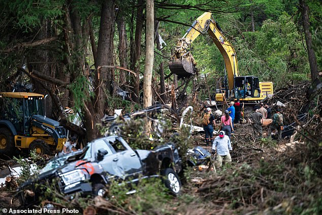 First responders carry out search and rescue operations near the Guadalupe River after a flash flood swept through the area