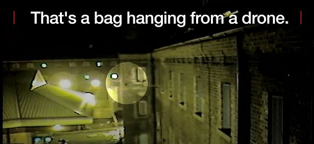 A video grab of a drone attempting to drop a bag into HMP Wandsworth in London