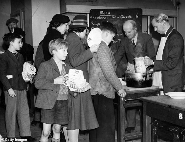 3rd October 1940: Teaching staff serving in the kitchen of Milbank School, London, which became a communal feeding centre during the Second World War
