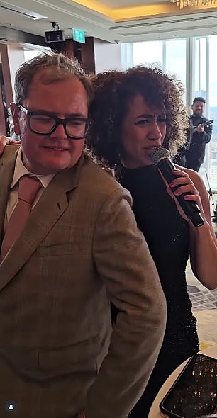 Alan Carr was seen enjoying himself as he and a fellow guest danced