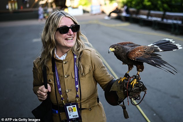 Rufus, pictured with handler Donna, patrols the skies of SW19 to keep pigeons away