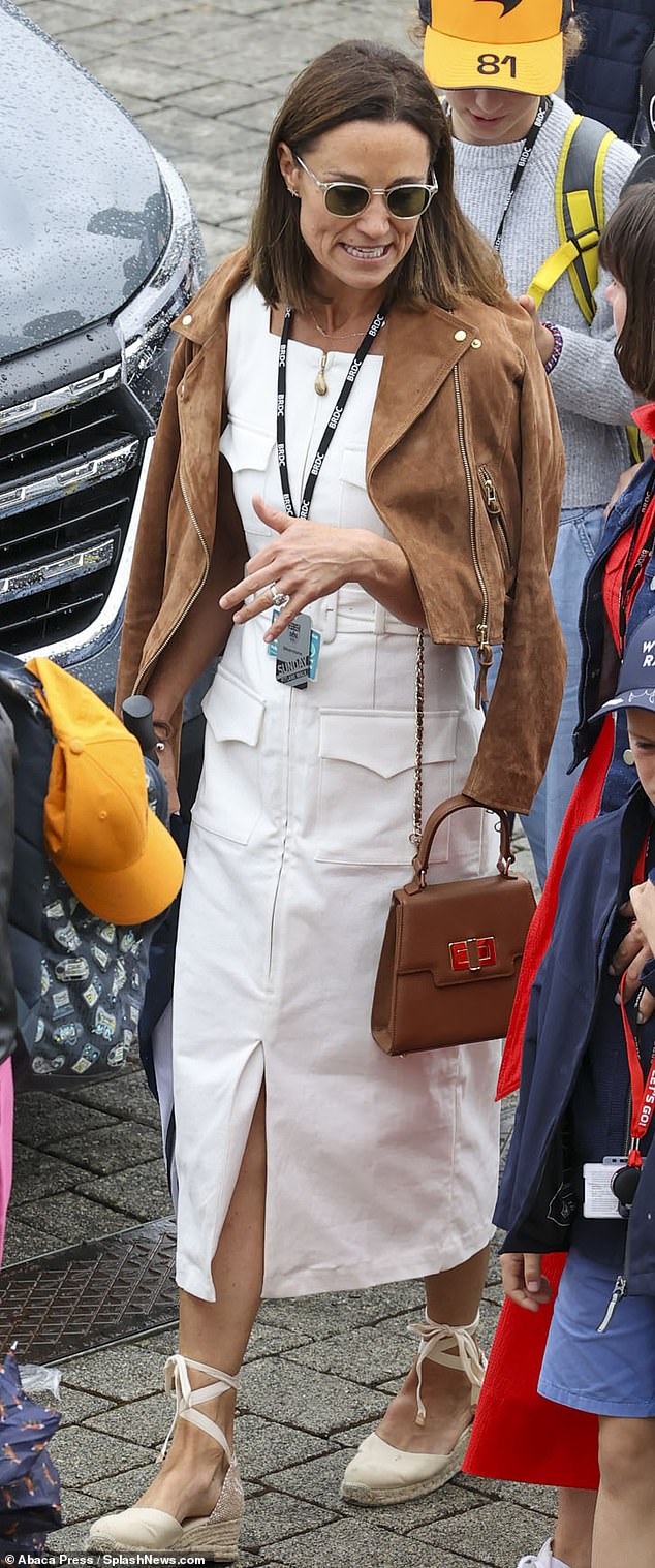 Pippa chose neutral tones for her outing on Sunday, sporting a white midi dress and tan suede jacket