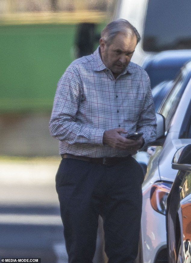Alan was sporting grey and white hair and appeared unshaven as he exited his vehicle