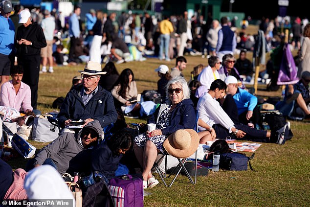 Spectators in the queue outside the All England Club this morning