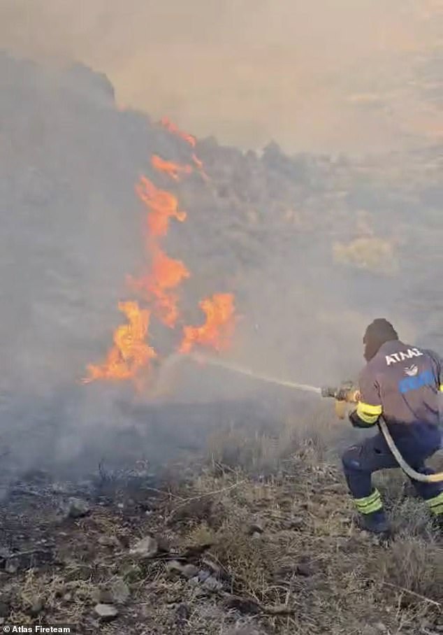 At least one firefighter was taken to hospital for smoke inhalation