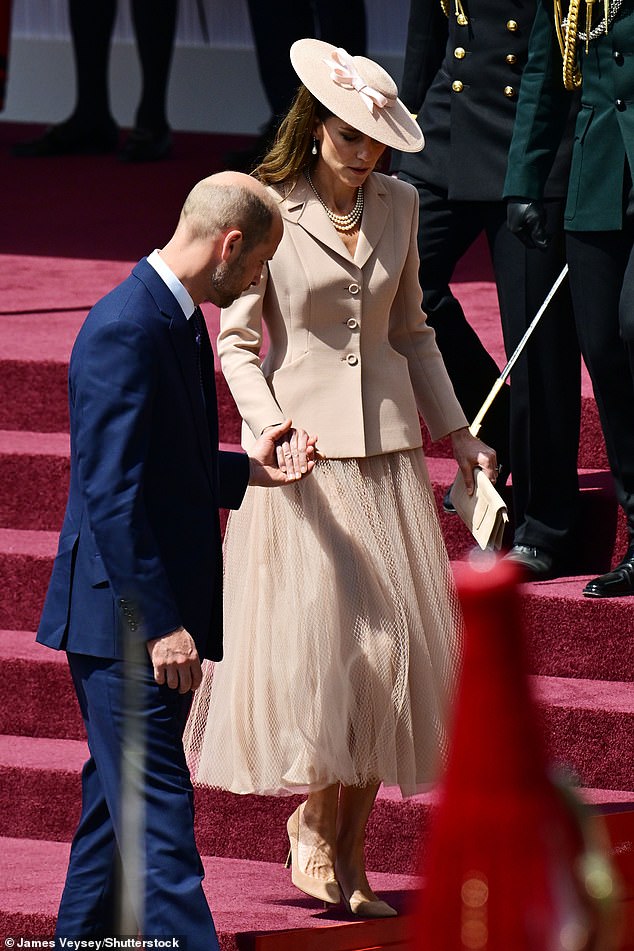 As they attended the ceremonial welcome at Datchet Road, the couple chatted freely, with Kate placing her hand on William's back