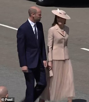 The royal couple were spotted conversing ahead of greeting their guests